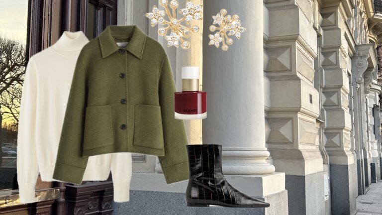 Olivenfrakk, kremgenser, rød Hermès parfyme og svarte skinnstøvler på en bybakgrunn.